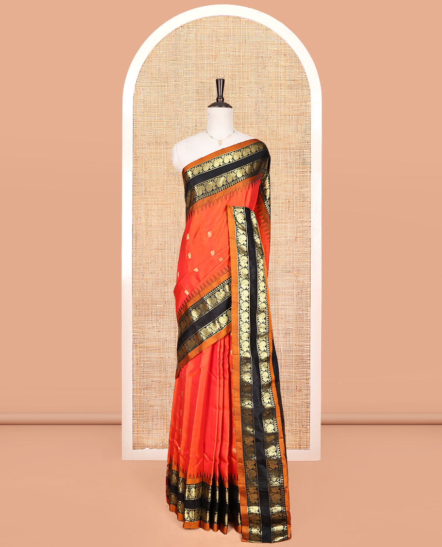 Orange Gadwal Silk Saree, Embellished with Peacock Buttas, Complemented by a Contrast Peacock Motifs Woven Temple Border, Grand Jaal Pallu, and a Contrast Blouse