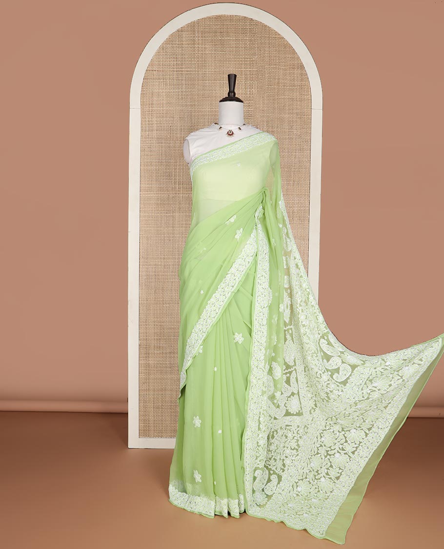 Light green floral motifs embroidery georgette saree with self embroidered border & floral thread embroidery pallu