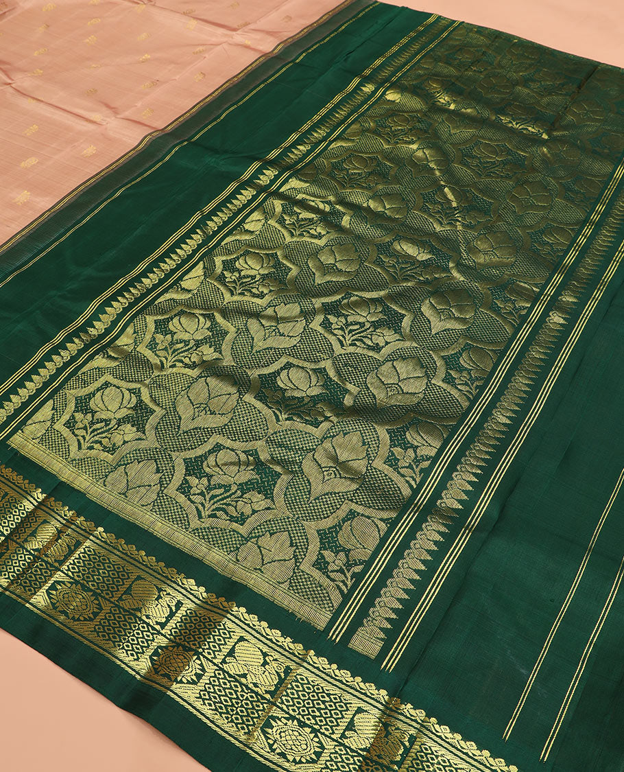 Peach zari buttas Kanchipuram silk saree, contrast one-sided thazampoo rekku checked border of salngai, banaras, mayil chakra and then kuli kann designs, and zari design pallu