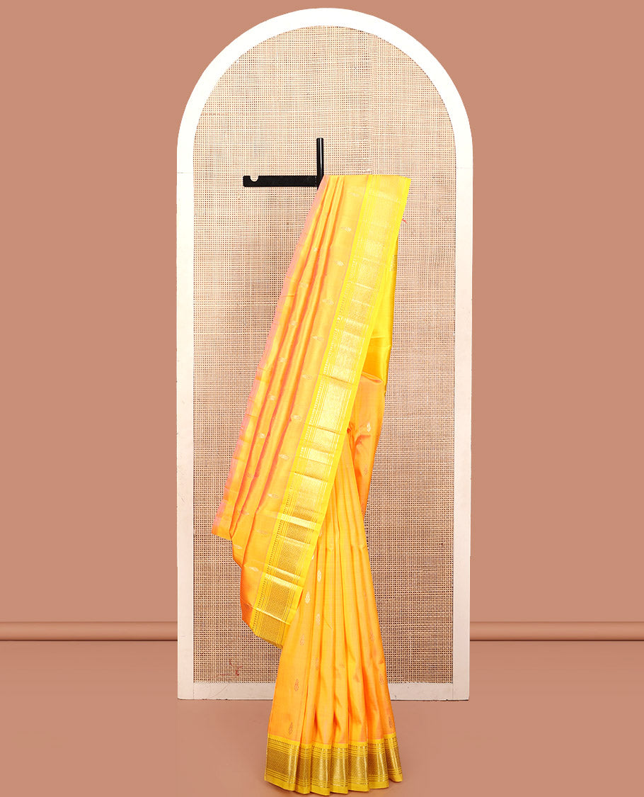 Yellow Kanchipuram Silk Saree, Subtly Sparkled with Zari Buttas, a Contrast One-Sided Border of Panner Sombu, Banaras, Muthu, and Jaal, Zari-Woven Pallu, and No Blouse