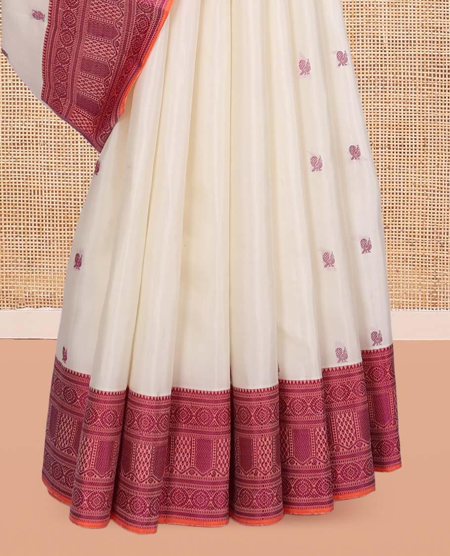 White Kanchipuram Silk Saree, Mesmerized with Mayil-Thread Buttas, Complemented by a Contrast Traditional Thread Woven Border, Jaal Pallu, and a Contrast Blouse
