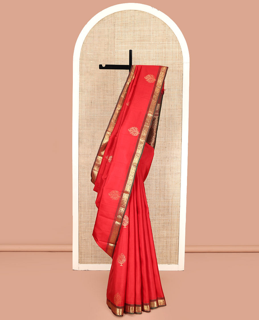 Red Kanchipuram Silk Saree, Decked Up with Zari Buttas All Over Its Body, Complemented by a Contrast Border of Ara Bogudi, Yaanai, and Annam Designs, Grand Pallu, and Paired with a Contrast Blouse