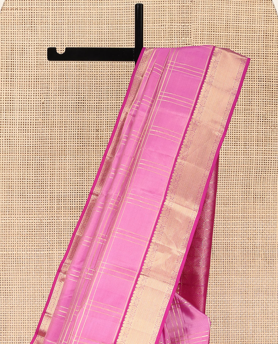 Pink Kanchipuram Silk Saree, Gleamed Up with Zari Checked Design on Its Body, Complemented by a Contrast Border of Manga, Rekku, Cross Kamalam, and Mayil Kann Designs, Grand Jaal Pallu, and Paired with a Contrast Blouse