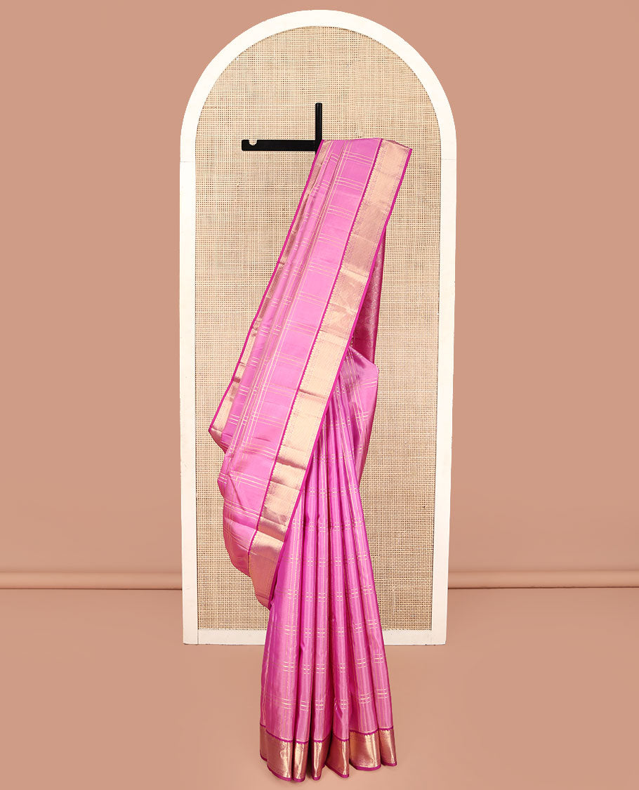 Pink Kanchipuram Silk Saree, Gleamed Up with Zari Checked Design on Its Body, Complemented by a Contrast Border of Manga, Rekku, Cross Kamalam, and Mayil Kann Designs, Grand Jaal Pallu, and Paired with a Contrast Blouse