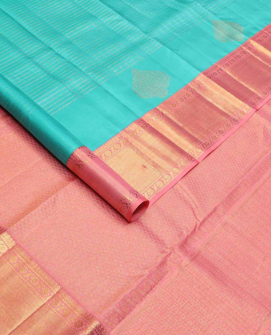 Blue zari buttas and checked Kanchipuram silk saree, contrast border of salngai, muthu, and cross kamalam designs, and jaal pallu