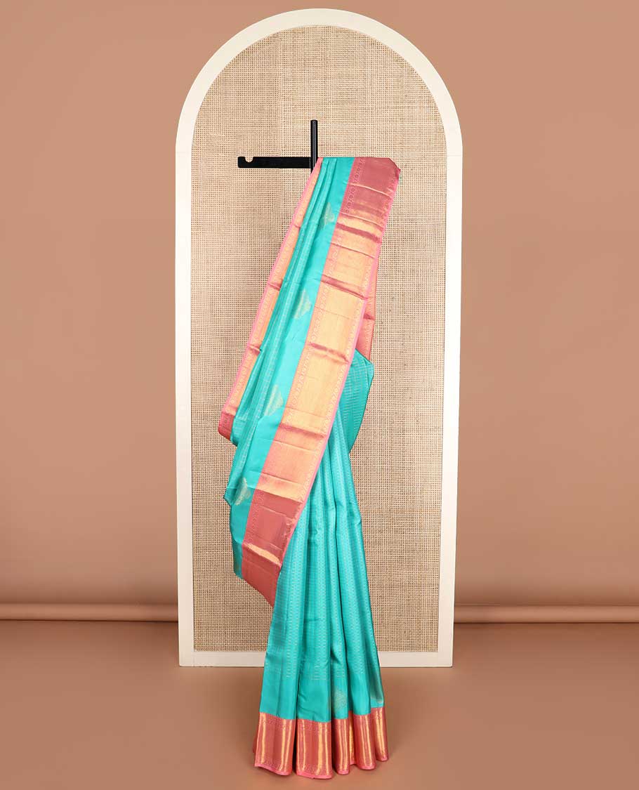 Blue zari buttas and checked Kanchipuram silk saree, contrast border of salngai, muthu, and cross kamalam designs, and jaal pallu