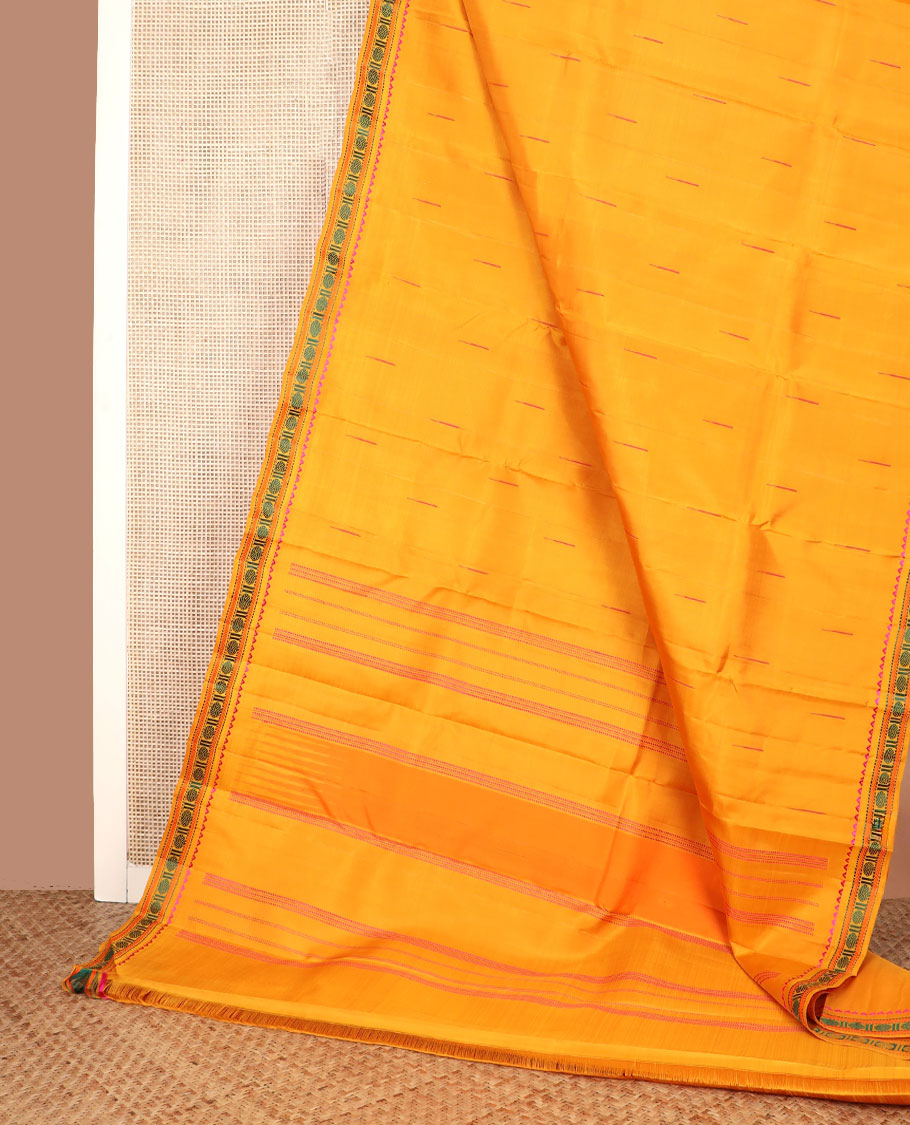 Yellow malli mokku buttas Kanchipuram silk saree, self-border of rekku, muthu, kathir, and rudraksham motifs, and seppu rekku pallu