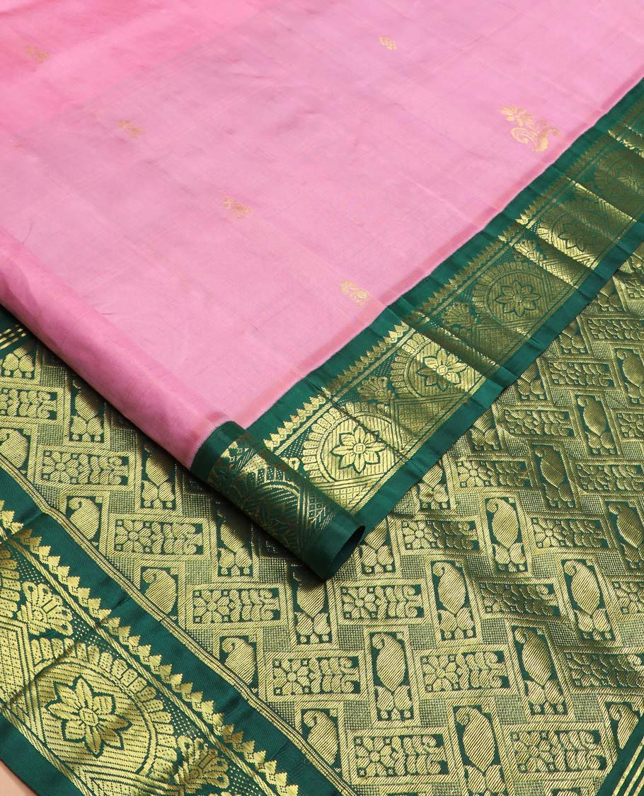 Pink zari buttas Kanchipuram silk saree, contrast one-sided border of thilakam mokku, chakram, and mayil kann, and floral-paisley pallu