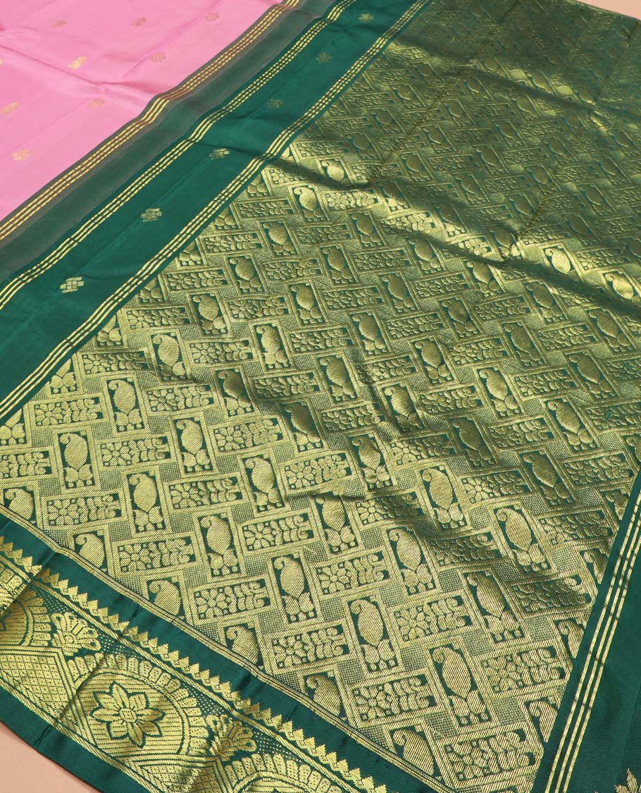 Pink zari buttas Kanchipuram silk saree, contrast one-sided border of thilakam mokku, chakram, and mayil kann, and floral-paisley pallu