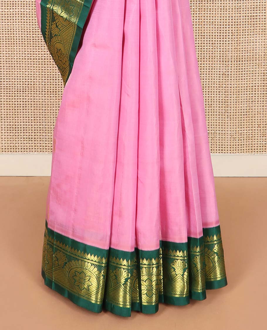 Pink zari buttas Kanchipuram silk saree, contrast one-sided border of thilakam mokku, chakram, and mayil kann, and floral-paisley pallu