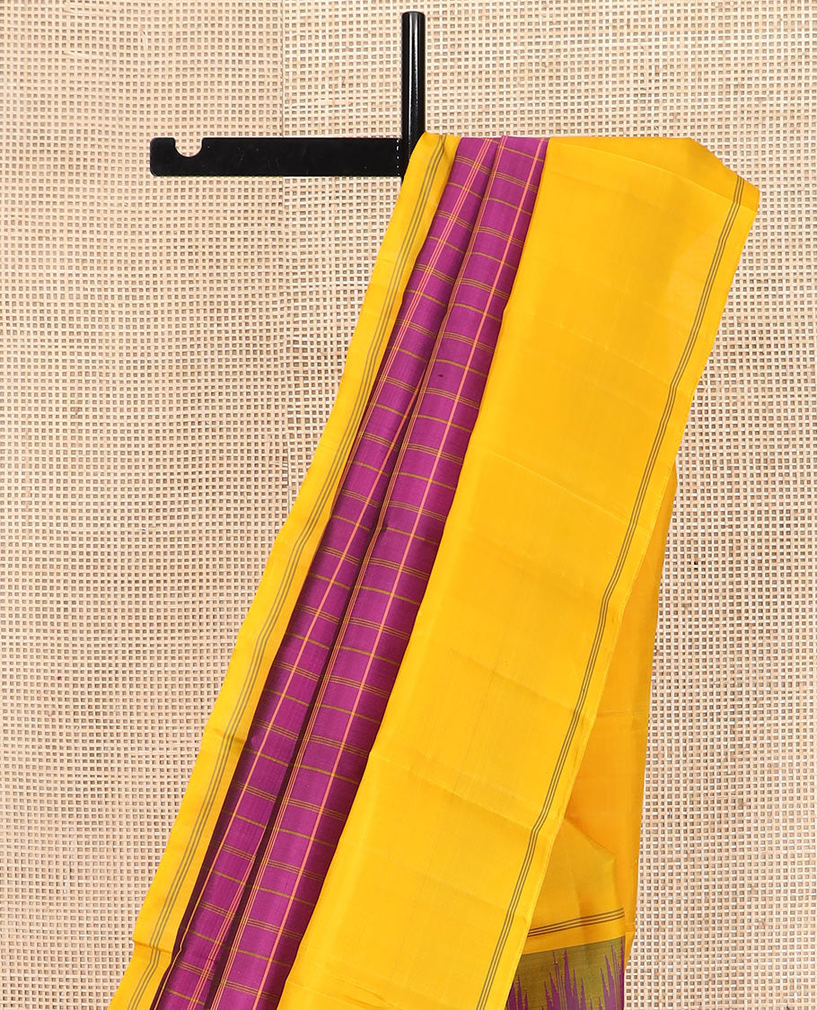 Purple checked Kanchipuram silk saree, contrast thazampoo rekku striped border, and striped pallu