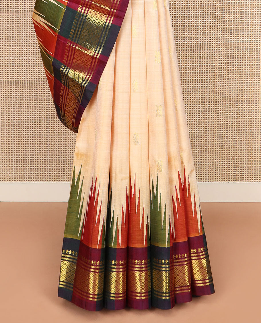Sandal Kanchipuram Silk Saree Sparsely Sparkled with Zari Buttas, Complemented by Contrast One-Sided Thazampoo Rekku Border of Paneer Sombu, Banaras, and Mayil Kann Designs, Grandly Woven Pallu Steeped with Floral Designs, and Comes Without a Blouse