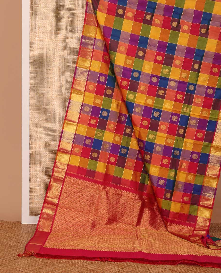 Multi-color paalum pazhamum checked annam chakram buttas Kanchipuram silk saree, zari border of thilakam mokku, rudraksham and vanki designs, and leaf vine pallu