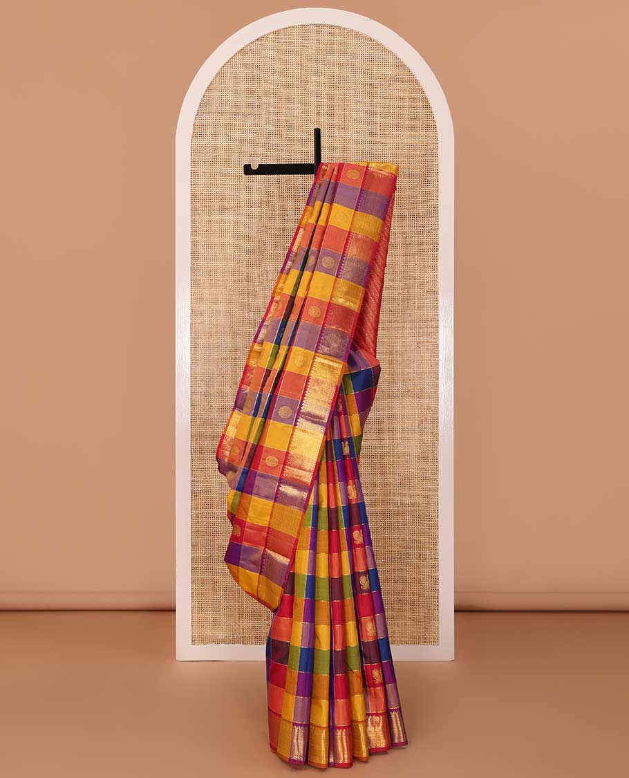 Multi-color paalum pazhamum checked annam chakram buttas Kanchipuram silk saree, zari border of thilakam mokku, rudraksham and vanki designs, and leaf vine pallu