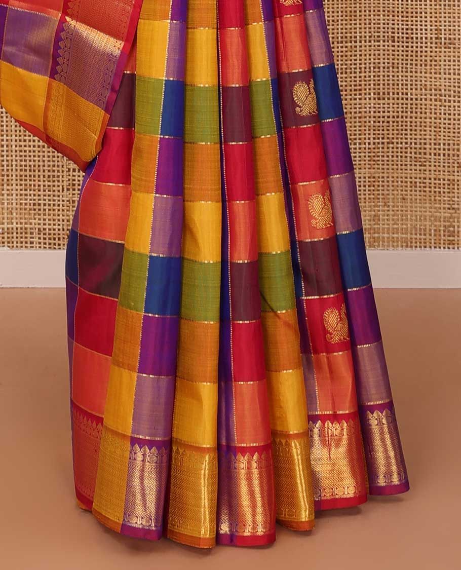 Multi-color paalum pazhamum checked annam chakram buttas Kanchipuram silk saree, zari border of thilakam mokku, rudraksham and vanki designs, and leaf vine pallu