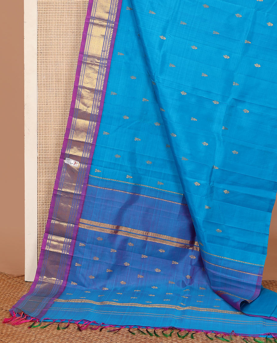 Aszure blue zari buttas Kanchipuram silk saree, contrast one-sided border of panner sombu, muthu, banaras, and jaal, and zari design pallu