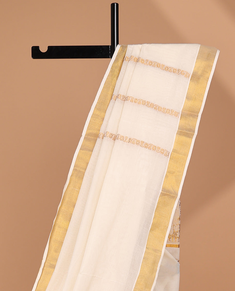 Cream kerala saree with zari stripes, zari border & pallu of intricate designs