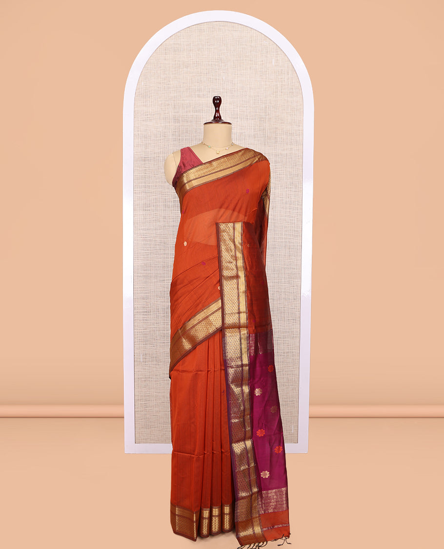 Orange Maheshwari Cotton Saree, Adorned with Buttas, Complemented by a Contrast Traditional Zari Border, Pallu Gleamed Up with Zari Buttas, and a Contrast Blouse