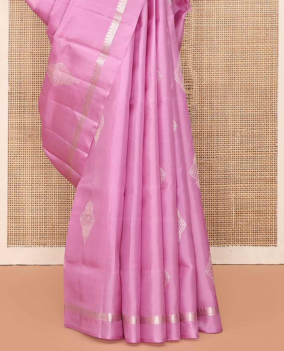 Pink Mayuri Soft Silk Saree, Embellished with Buttas All Over Its Body, Subtly Sparkled Kal Erangina Border of Thilakam Mokku Designs, Intricately Woven Pallu of Chevron Designs, and Paired with a Matching Blouse