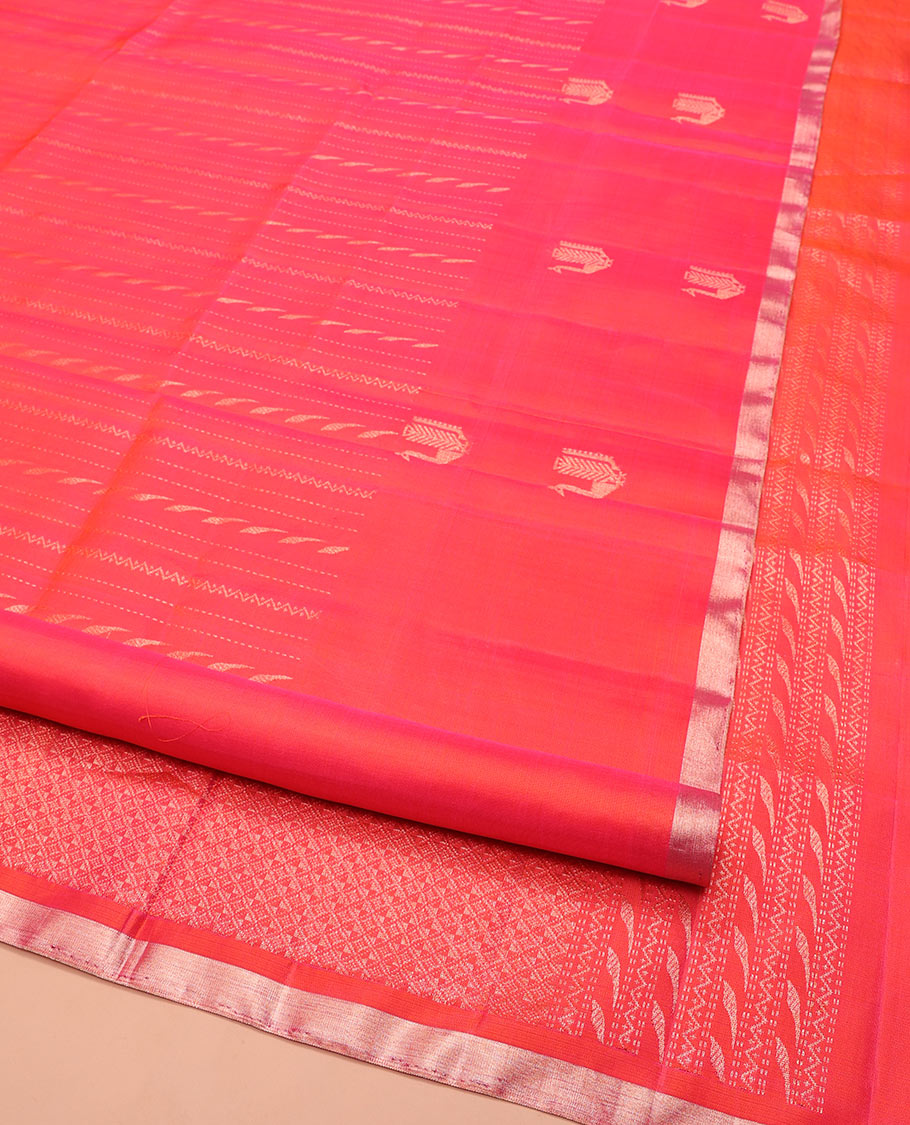Orange Mayuri Soft Silk Saree, Mesmerized with Neli, and Muthu Designs All Over Its Body, Highlighted by Zari Border of Peacock Designs, Boldly Accentuated Jaal Pallu, and Paired with a Matching Blouse