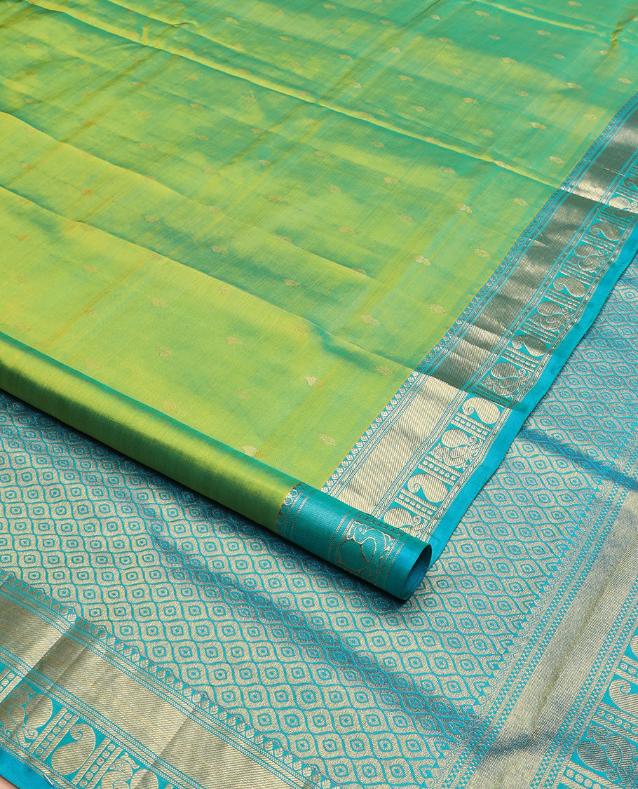 Green zari buttas nine-yard silk saree, contrast traditional of thilakam, banaras, zari stripes, mayil, and manga designs, and jaal pallu