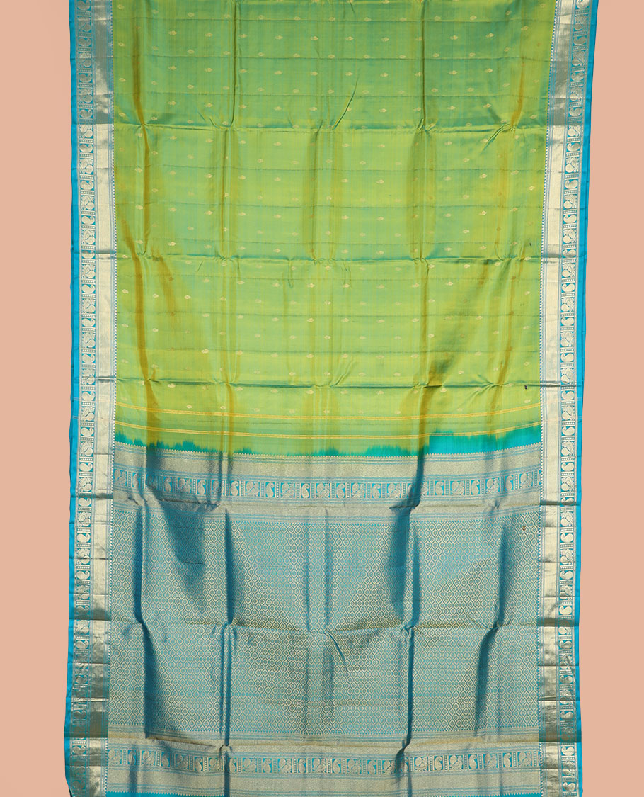 Green zari buttas nine-yard silk saree, contrast traditional of thilakam, banaras, zari stripes, mayil, and manga designs, and jaal pallu