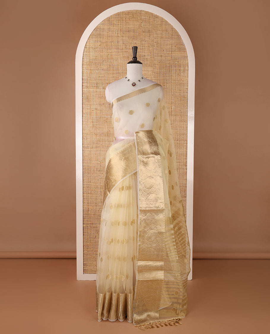 Cream semi-organza saree with zari buttas, zari border of temple & floral creeper designs, zari design pallu & running blouse