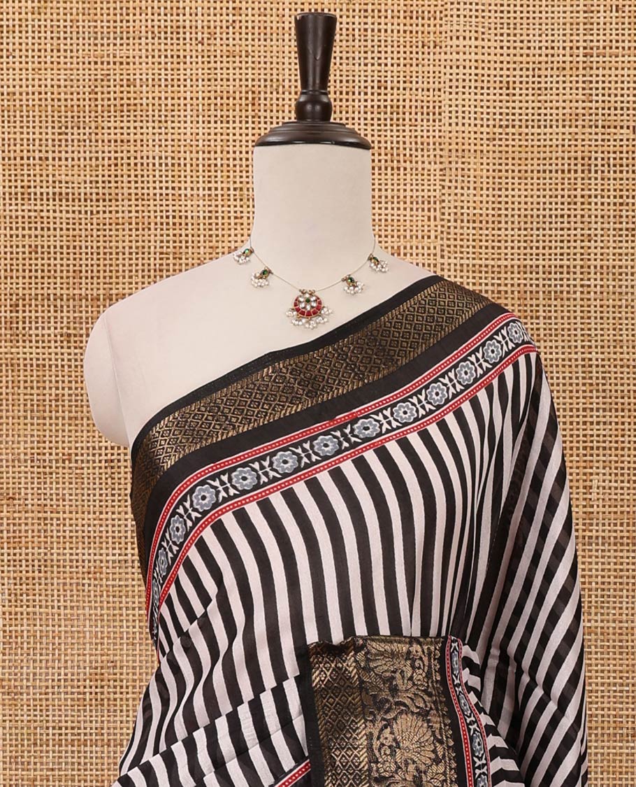 Black stripes printed soft dola saree,contrast floral creeper design zari border,Ajrakh-print pallu & blouse of floral butta & zari design
