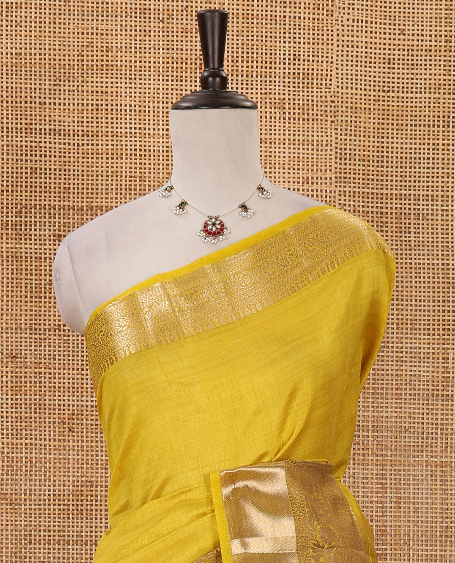 Yellow plain tussar saree, traditional zari design border, pallu of zari stripes & matching traditional motif border blouse