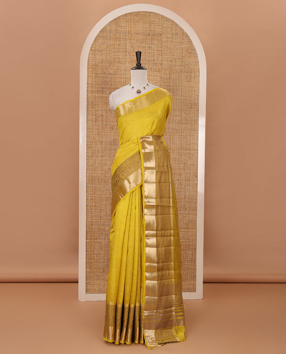 Yellow plain tussar saree, traditional zari design border, pallu of zari stripes & matching traditional motif border blouse