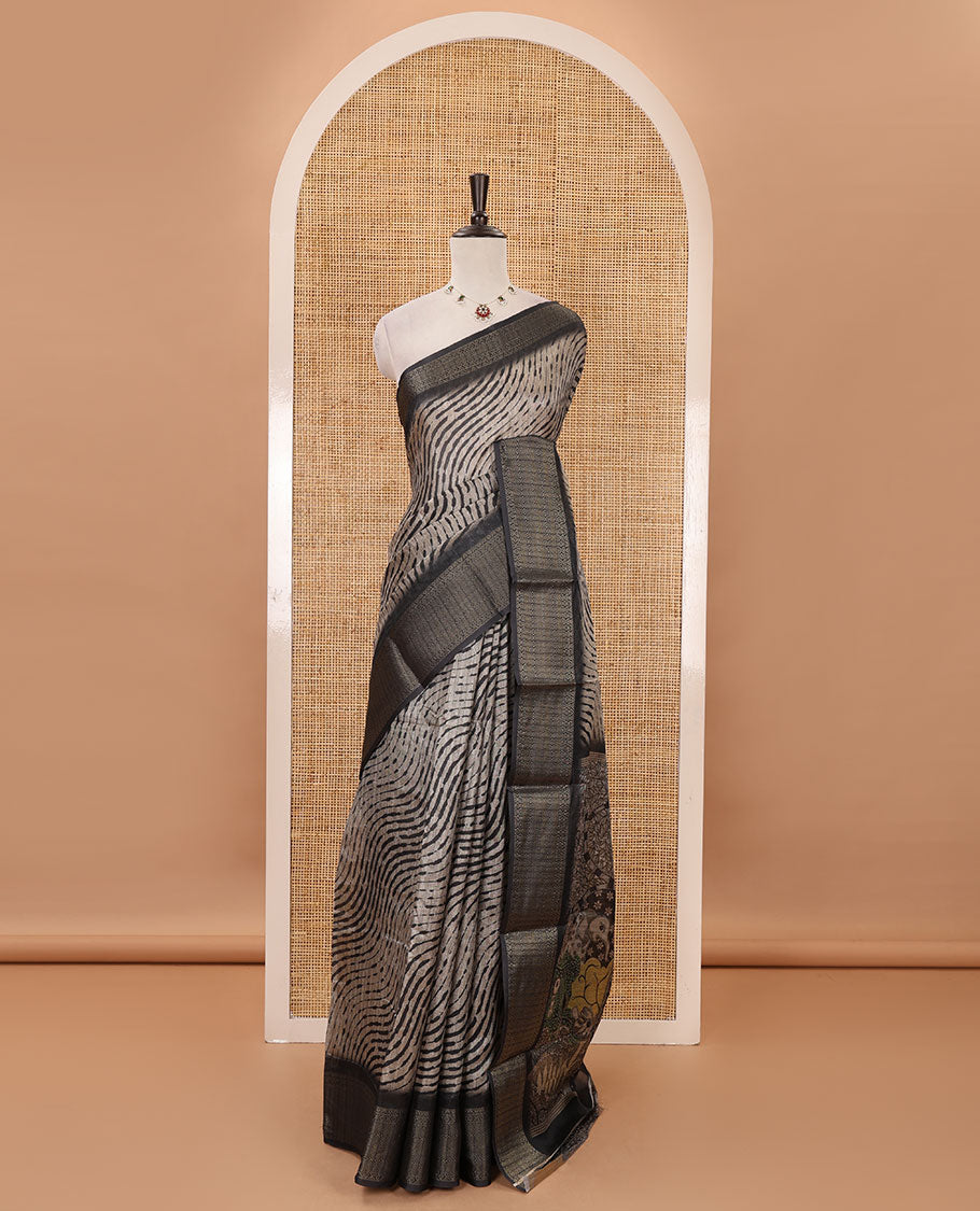 Chikku lehariya stripes printed semi-jute saree, contrast geometric zari border, printed pallu, & black blouse of print & zari work