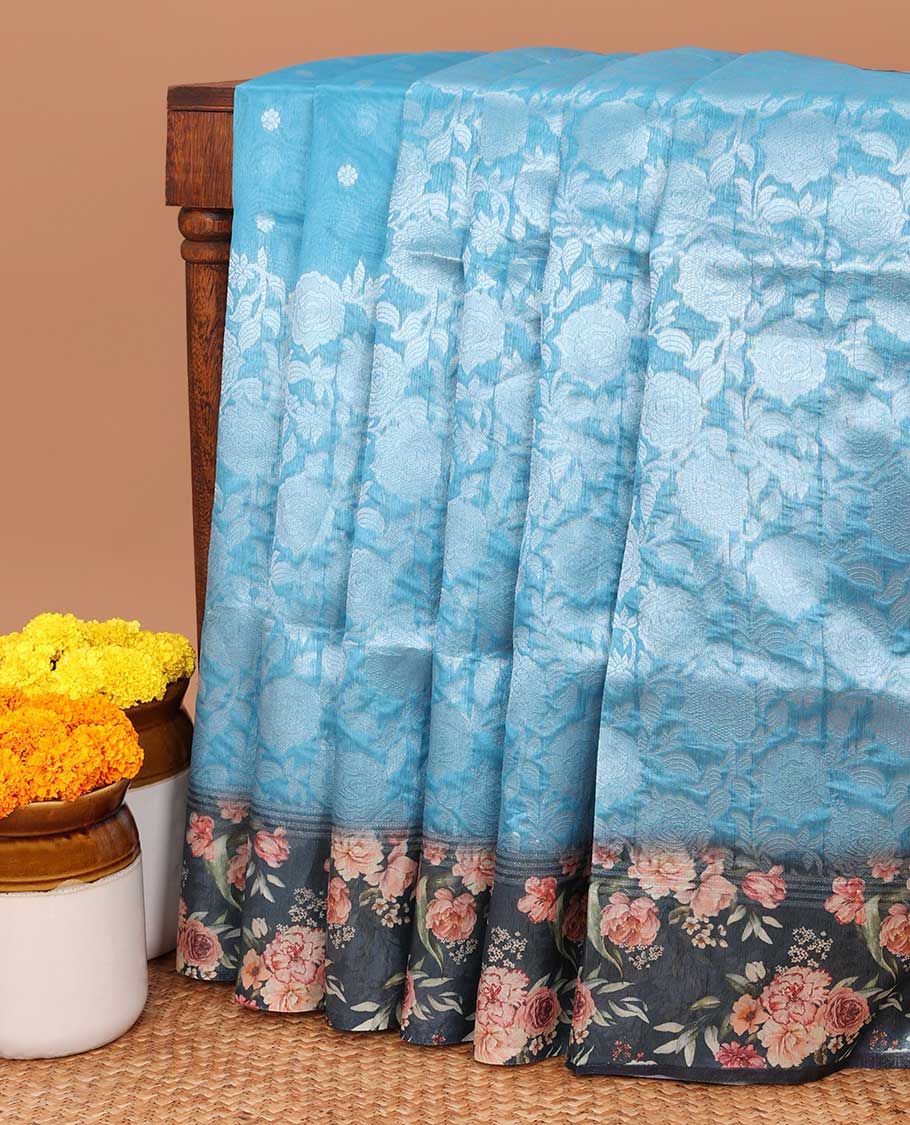 Sky blue floral , leaf traditional zari design elite silk saree with contrast floral printed border & floral design with tussels pallu