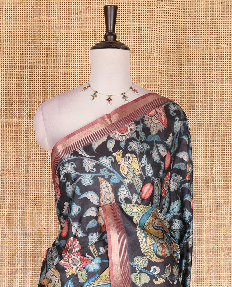 Black-base multi-color kalamkari floral-vine and peacocks printed semi-tussar saree, gold zari piping border, kalamkari printed pallu, and contrast printed blouse