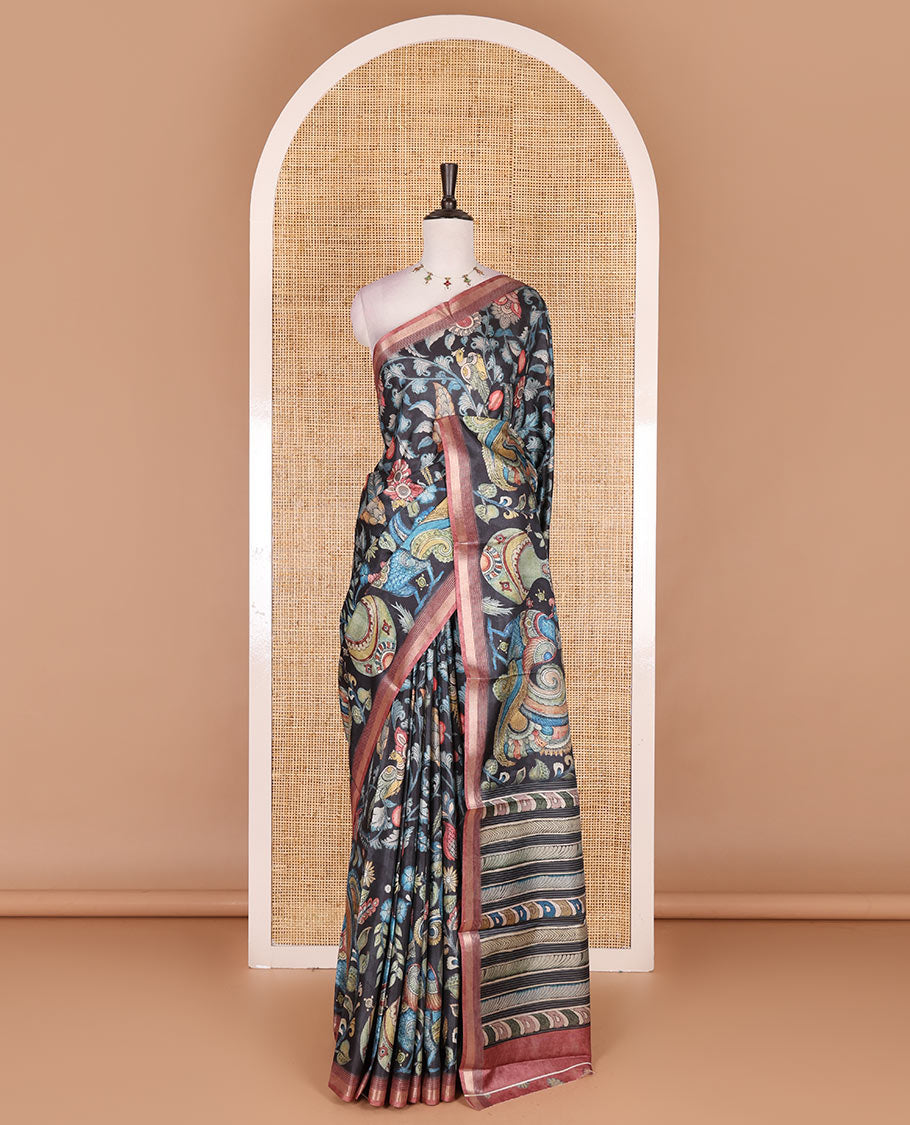 Black-base multi-color kalamkari floral-vine and peacocks printed semi-tussar saree, gold zari piping border, kalamkari printed pallu, and contrast printed blouse