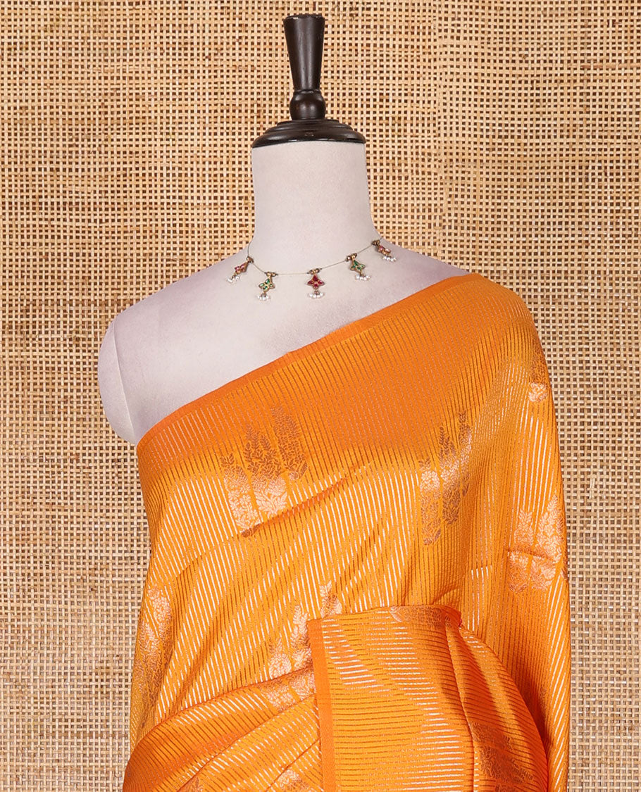 Borderless yellow stripes and zari floral buttas elite soft silk saree, contrast ogee patterned zari pallu, and contrast zari design blouse