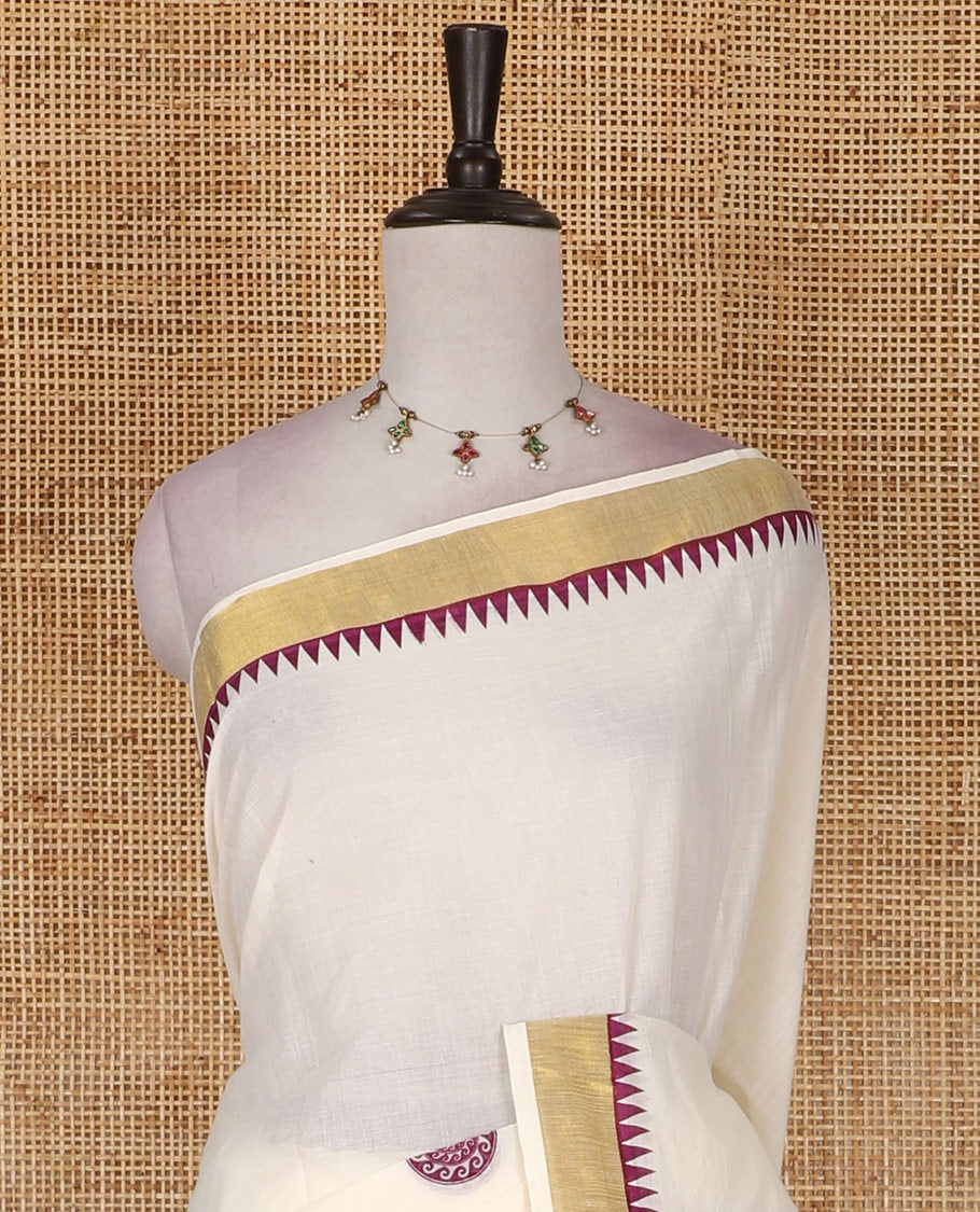 Half-white and maroon chakram motifs printed Kerala cotton saree, temple gold zari border, gold zari pallu, and matching blouse