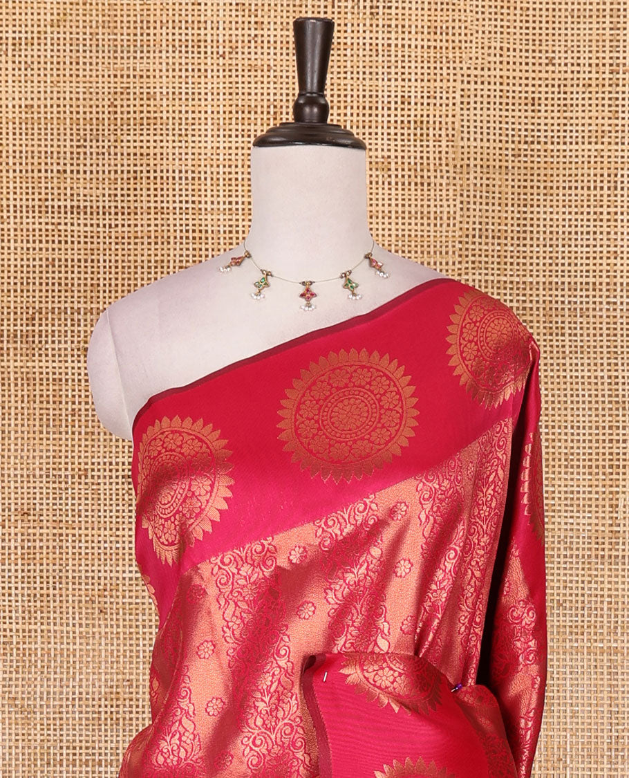 Pink jacquard kanchi tissue saree, zari chakram motifs border, intricately zari woven pallu, and a matching zari design blouse