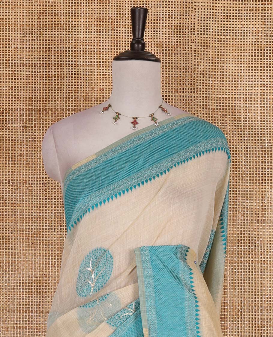 Chikku and rama blue munga cotton saree with round tree buttas, traditional thread motifs woven border, round tree motifs pallu, and thread woven blouse
