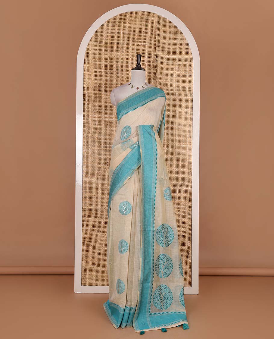 Chikku and rama blue munga cotton saree with round tree buttas, traditional thread motifs woven border, round tree motifs pallu, and thread woven blouse