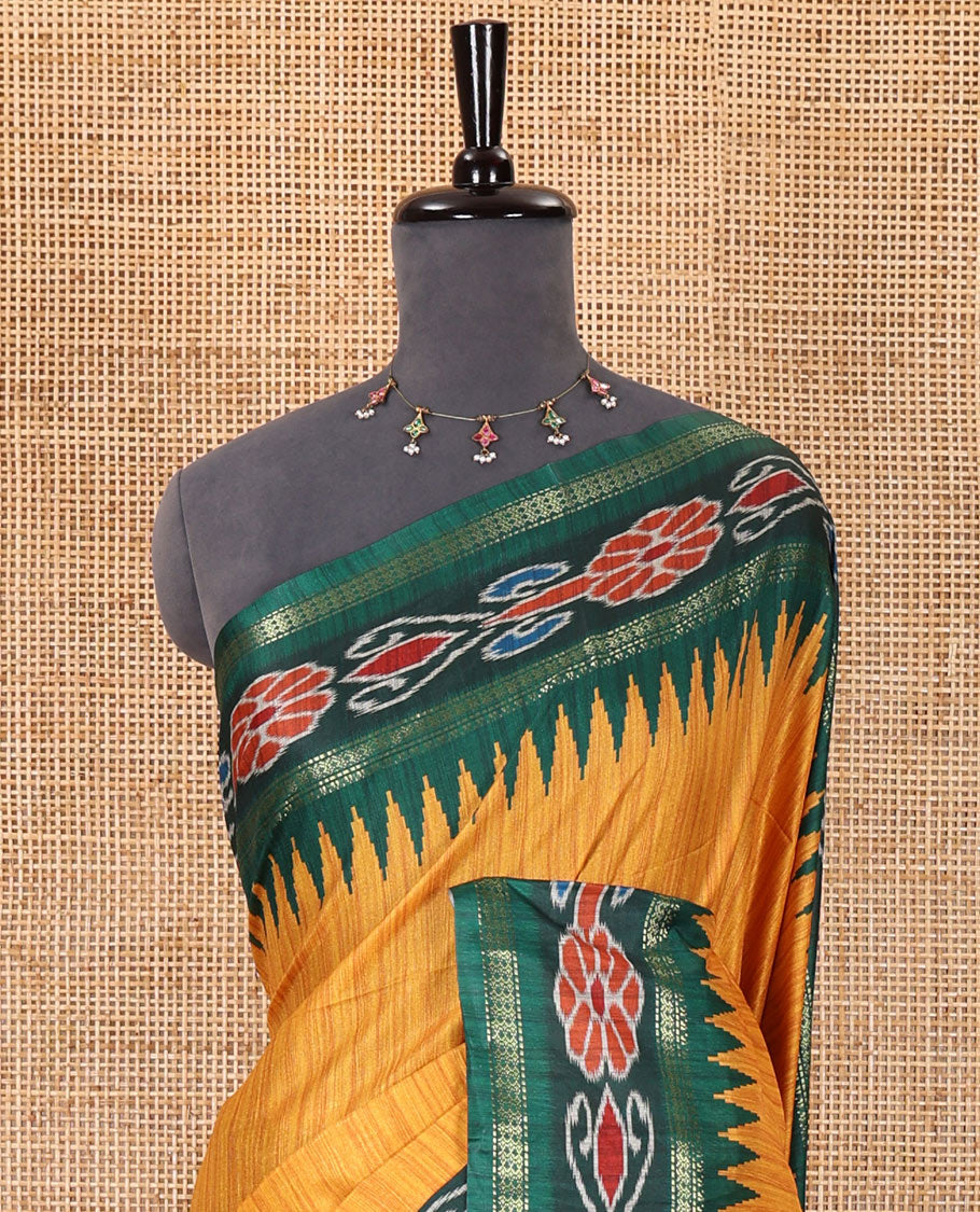 Yellow plain Katan silk saree, contrast temple ikkat floral printed border, ikkat floral printed pallu, and ikkat printed blouse