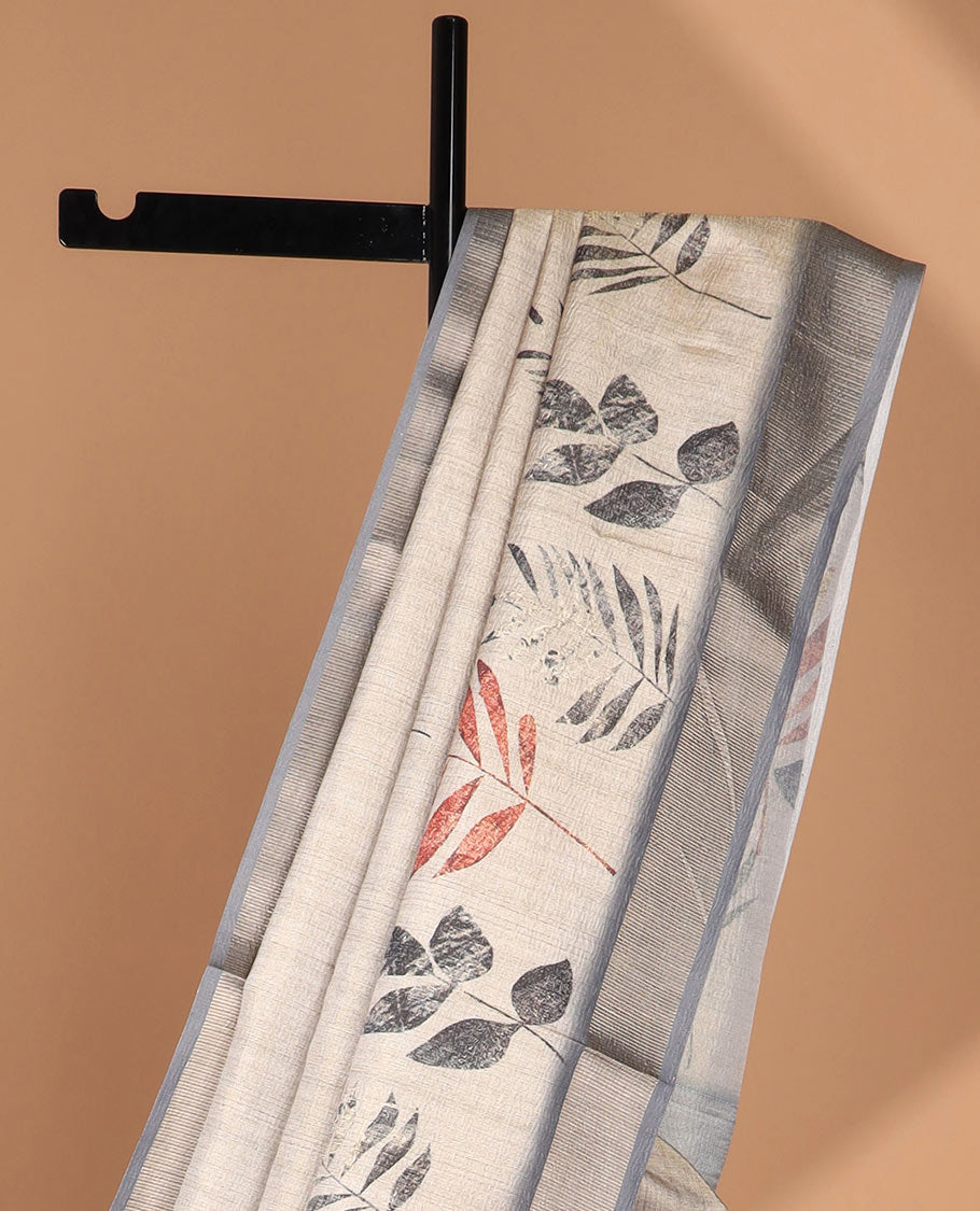 Cream leaf print tussar saree with tissue border & crush tissue pallu along with crush leaf print blouse