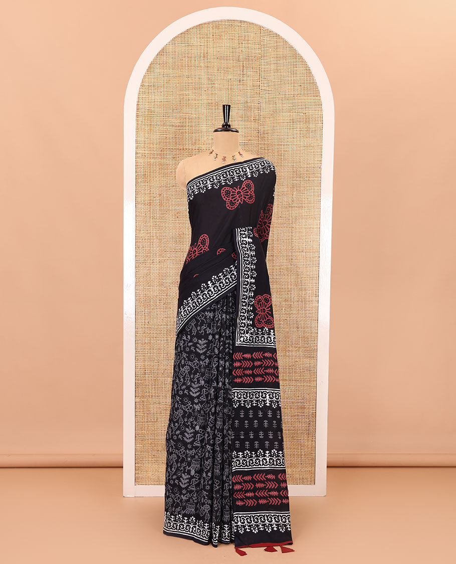 Black half-and-half style butterflies and warli theme block printed soft mul cotton saree, printed border, floral printed pallu, and a plain blouse