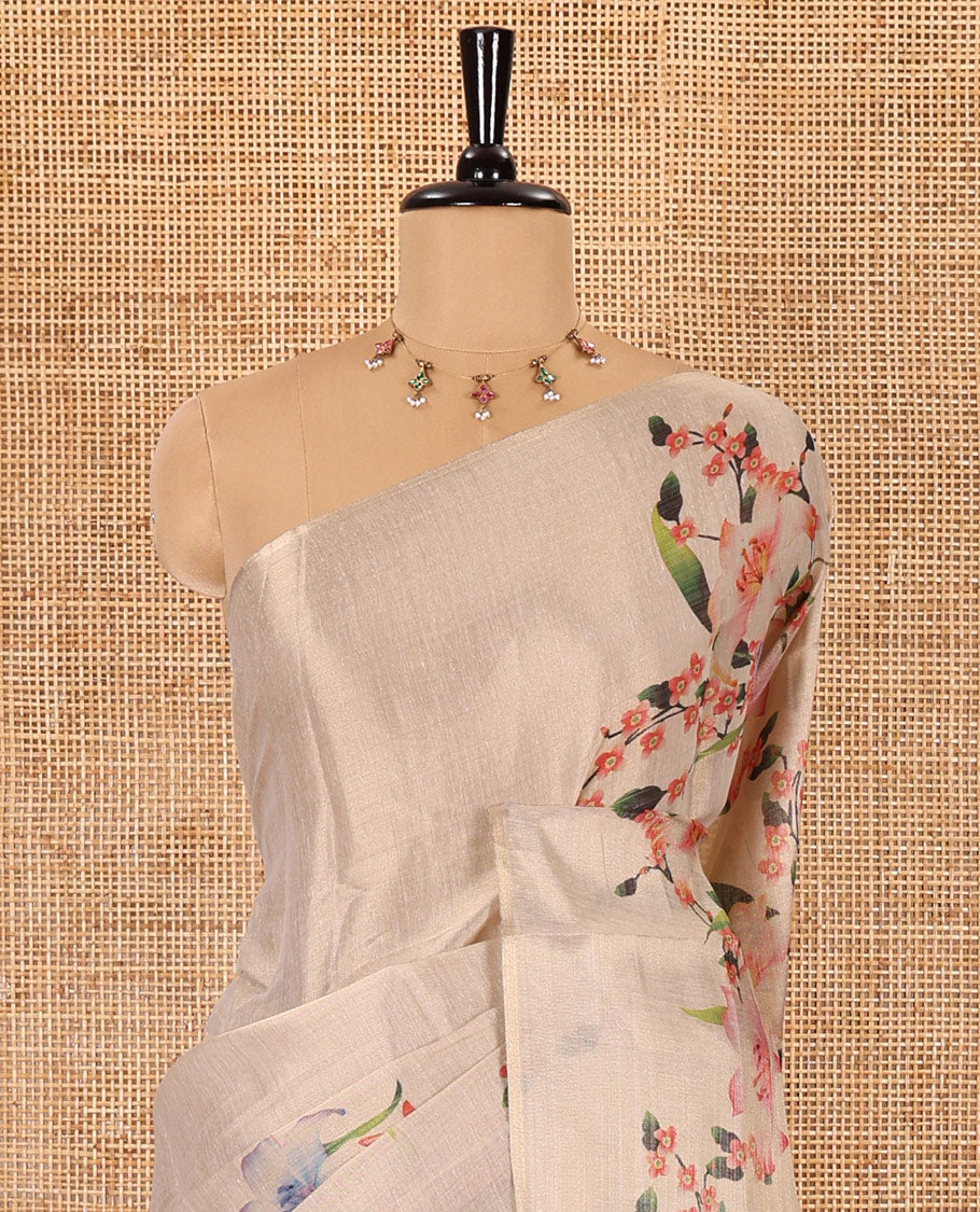 Cream plain tissue saree with hand painting style floral motifs printed border, and pallu and a printed blouse