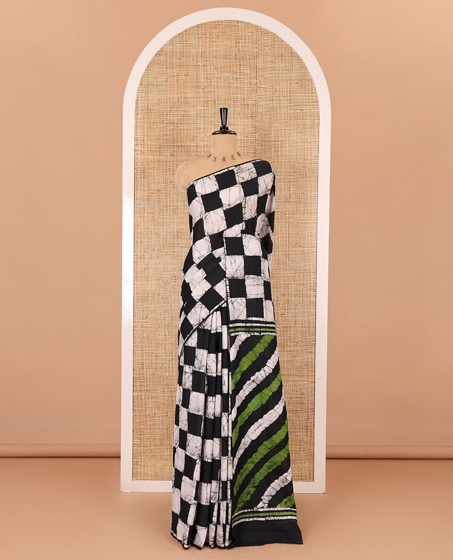 Borderless black green chess theme batik printed mul cotton saree with contrast leheriya striped pallu, and a contrast batik printed blouse