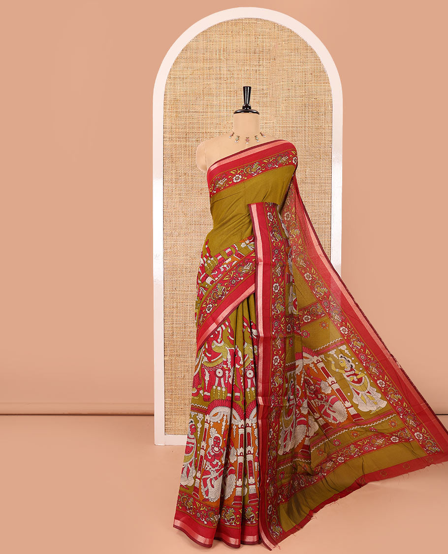 Mehendi green human figurines printed muslin cotton saree, contrast floral-peacock printed border of piping work, kalamkari printed pallu, and a contrast blouse of flower motifs print