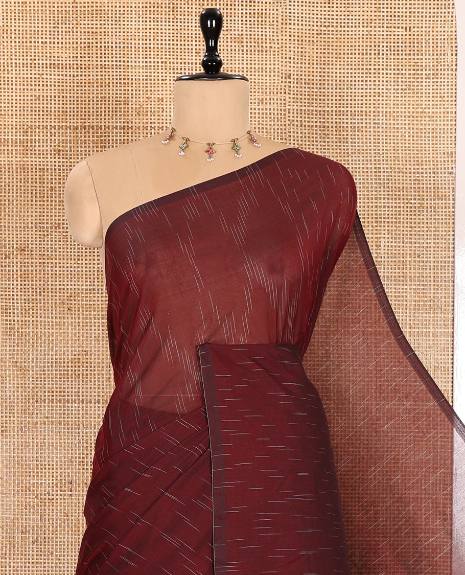 Borderless Maroon Khadi Mul Cotton Saree Decked with Jharna-Style Waterdrop Motifs, Featuring a Gleaming Zari-Woven Pallu, Paired with a Matching Blouse Replicating the Body Motifs