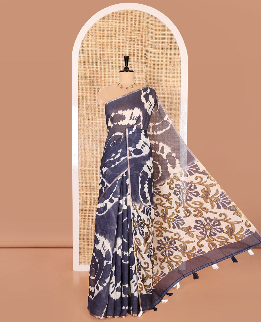 Borderless Navy Blue Linen Cotton Saree Accentuated with Shibori Prints, Complemented by Contrast Pallu Steeped with Floral Vine Print, and Paired with a Contrast Floral Printed Blouse