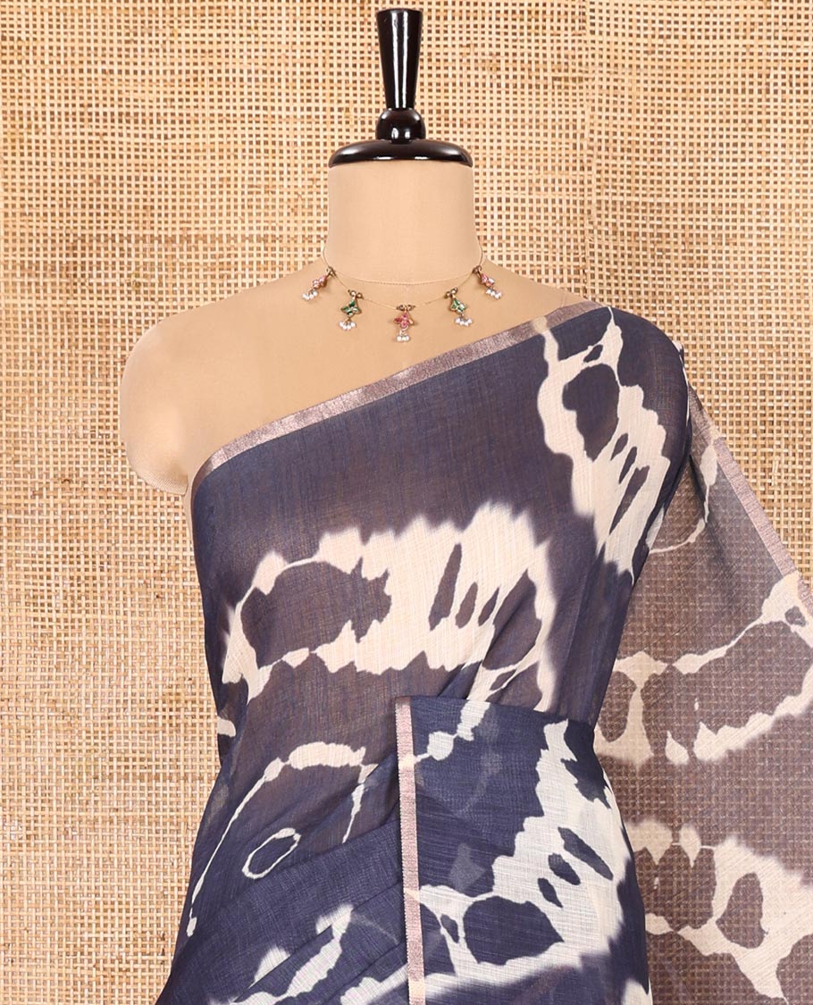 Borderless Navy Blue Linen Cotton Saree Accentuated with Shibori Prints, Complemented by Contrast Pallu Steeped with Floral Vine Print, and Paired with a Contrast Floral Printed Blouse
