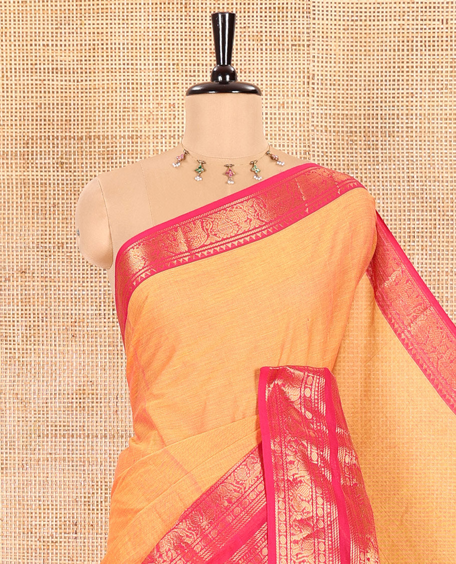 Orange Plain Chettinad Cotton Saree Highlighted with a Contrasting Temple Rettai Pettu Border of Peacock-Elephant Motifs, a Subtle Pallu of Stripes, and a Matching Blouse