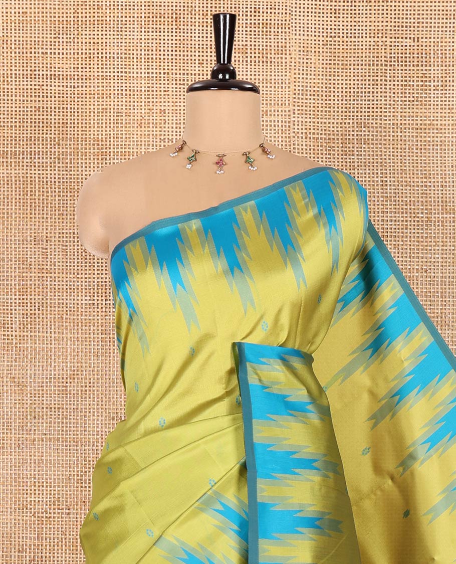 Apple Green Kanchi Silk Saree Detailed with Thread Buttas All Over Its Body, Complemented by a Contrast Temple Border, Grandly Woven Pallu of Intricate Design Weave, and Paired with a Contrast Blouse